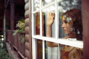 woman peeping on the window