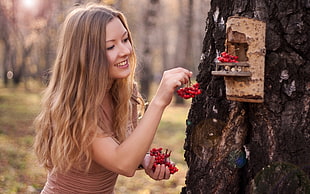 woman' in blonde hair holding berries HD wallpaper