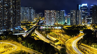 lighted city buildings, night, cityscape