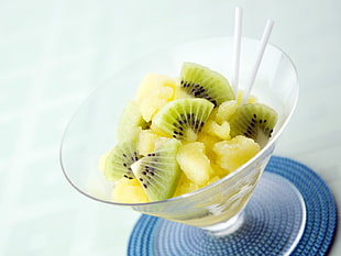 sliced kiwi fruits in footed glass container HD wallpaper