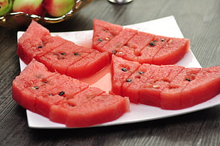 sliced watermelon on white ceramic plate HD wallpaper