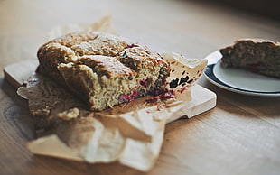 brown cake on wooden board