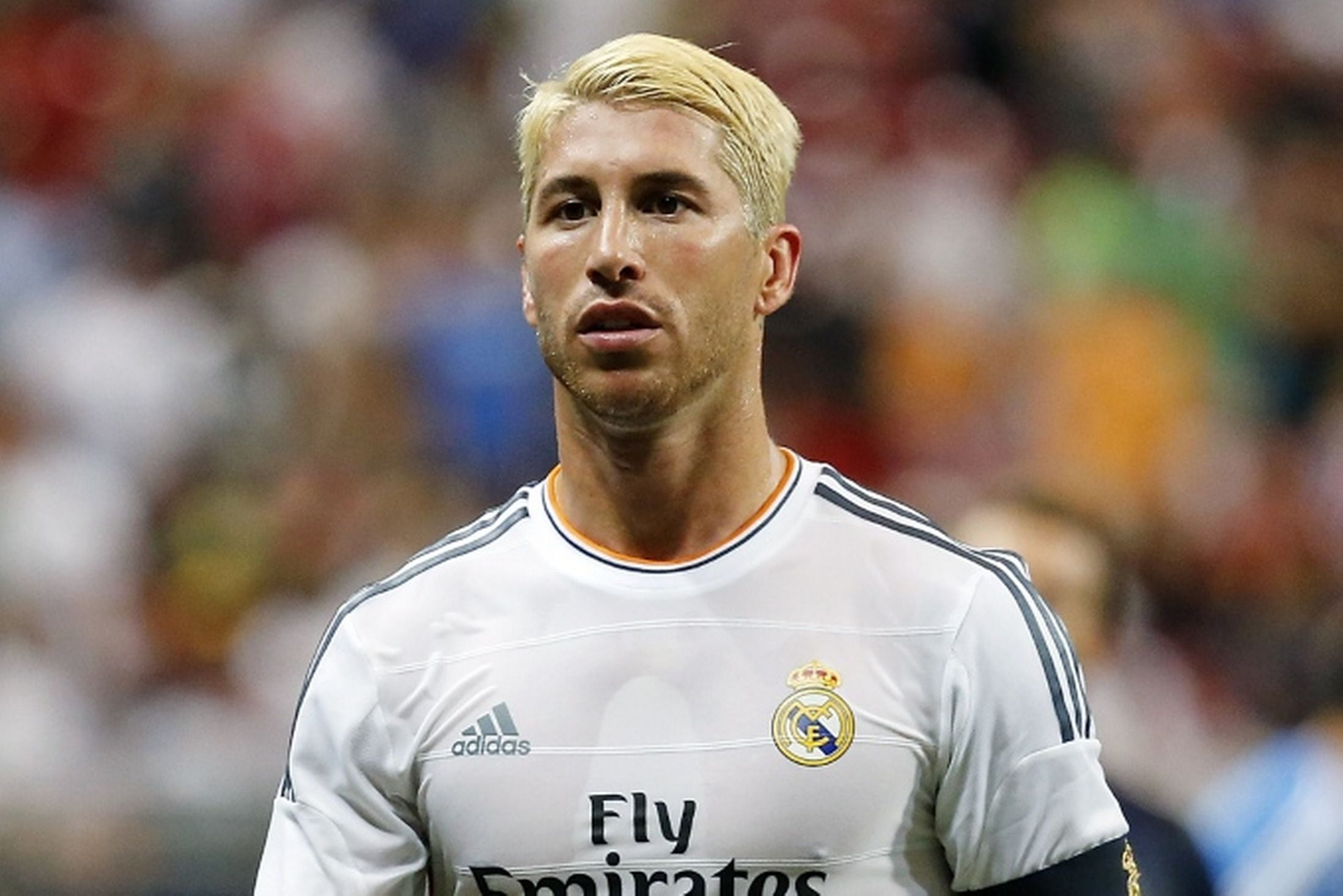 selective focus photography of man in white soccer jersey