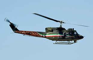 green helicopter flying on air HD wallpaper