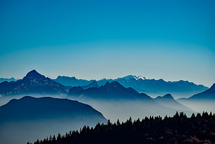 view of mountain with fogs during daytime HD wallpaper