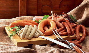 assorted sausages on chopping board HD wallpaper