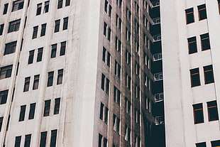 beige and black concrete high rise building