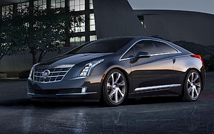 black Cadillac CTS on road during daytime