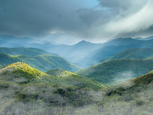 mountains under gray sky