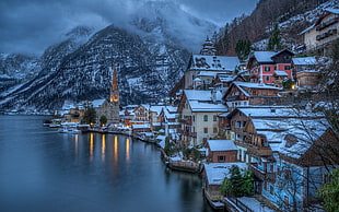 brown and white houses, city, mountains, mist, sea