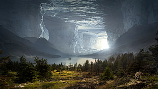 field of green grass in front of a wide ocean in a white cave