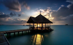black and brown table lamp, pier, hut, water, clouds HD wallpaper