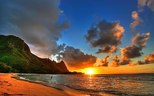 photography of seashore and mountain