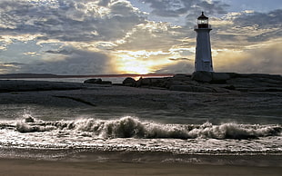 silhouette of lighthouse at golden hour