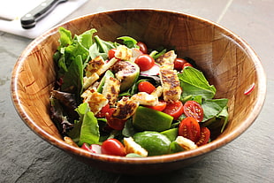 brown ceramic bowl with vegetable dish