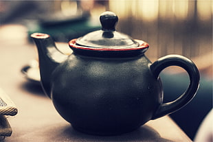 black ceramic tea pot placed on brown wooden panel HD wallpaper