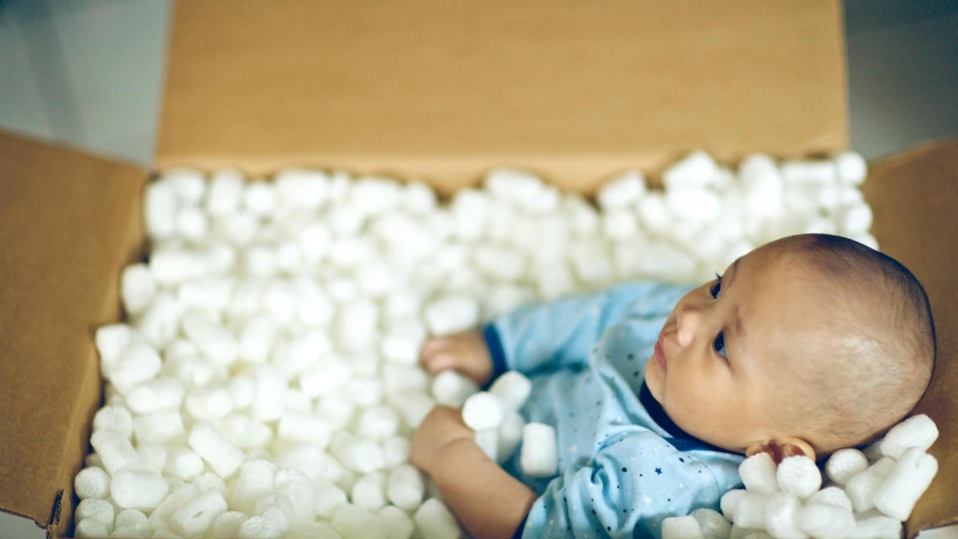 baby on cardboard box