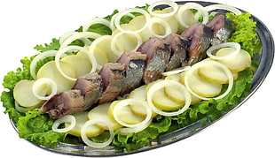 fish with white onions, lettuce, and zucchini dish