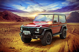 red and black Mercedes-Benz G-class SUV on dessert during daytime HD wallpaper