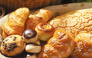 pastry breads topped with chocolate chips and sesame seeds