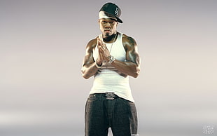 male rapper wearing white tank top, black bottoms and flat brim cap HD wallpaper