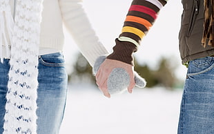 man and woman holding hands