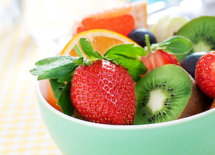 selective focus photography of strawberry and kiwi in bowl HD wallpaper