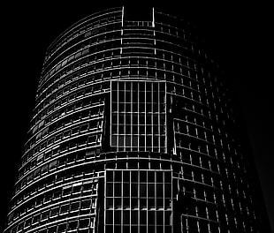 grayscale architectural shot of round high rise building HD wallpaper