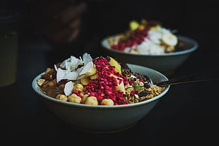 two white bowls, Salad, Nuts, Berries