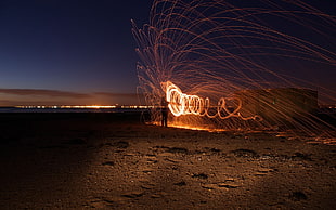 orange and white fireworks, motion blur, in-line, circle, night