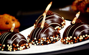 chocolate coated cakes served on white ceramic plate HD wallpaper