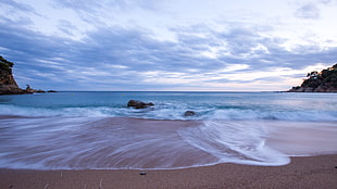 panoramic photography of beach and stones HD wallpaper