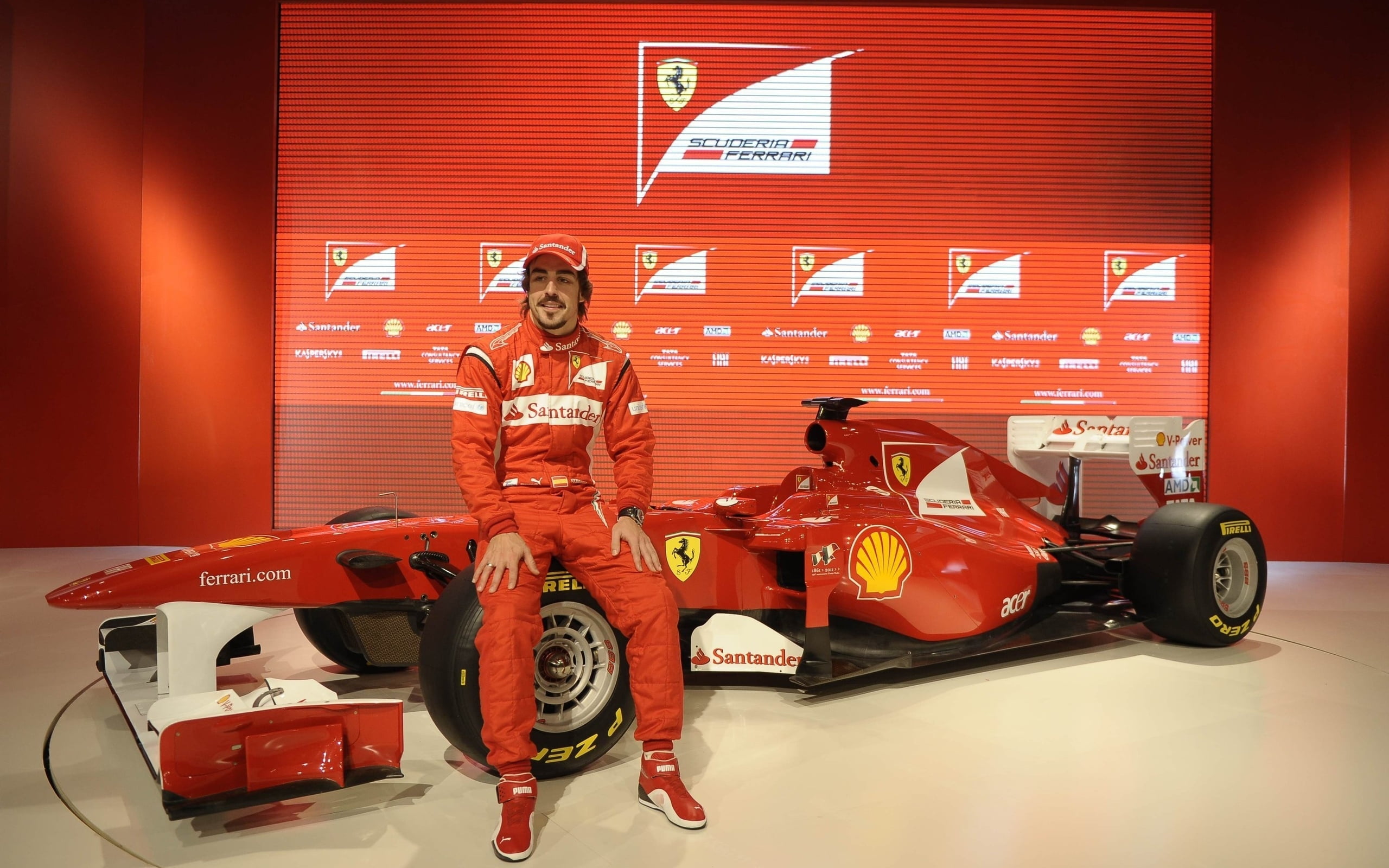 Man in red overall suit with Ferrari F1 racing car HD wallpaper | Wallpaper  Flare