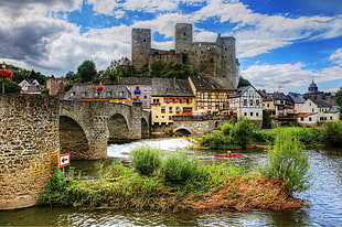 castle surround with house and bridge