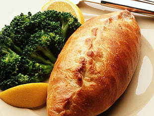 baked bread with broccoli on white surface HD wallpaper