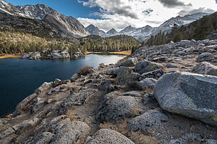 river surrounded by mountain and rock HD wallpaper