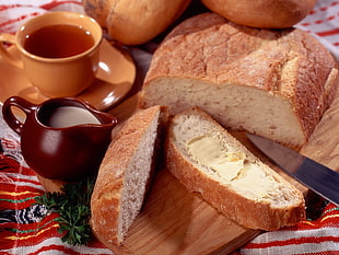 sliced bread with knife and cream