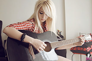 woman playing guitar