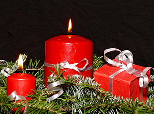 red pillar candle beside gift box HD wallpaper