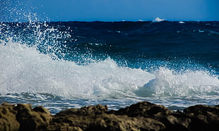 wave crashing through rock