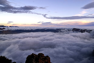 sea of clouds during yellow sunset, grand canyon national park