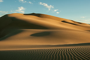 brown desert under blue and white cloudy sky during daytime HD wallpaper