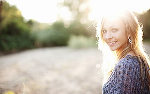 woman wearing purple dress under The sun set