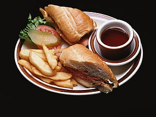 leavened bread served on white and red ceramic plate with tea cup