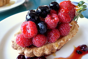 pie with assorted fruits on white ceramic plate