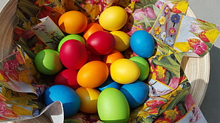 several colored eggs on multicolored floral textile HD wallpaper