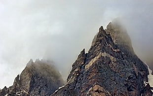 rocky mountain covered the top with fogs at foggy time, emerald lake