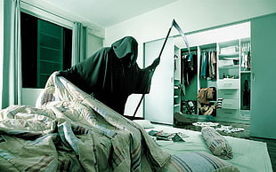 person wearing black cape holds scythe in room HD wallpaper