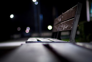 selective photography of brown bench under dark sky HD wallpaper