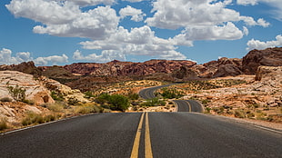 white and blue floral textile, clouds, rocks, road, desert